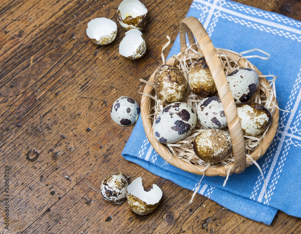 quail eggs in a basket on a wooden table quail eggs in a basket on a wooden table