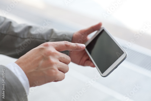 Fototapeta Naklejka Na Ścianę i Meble -  Businessman holding digital tablet