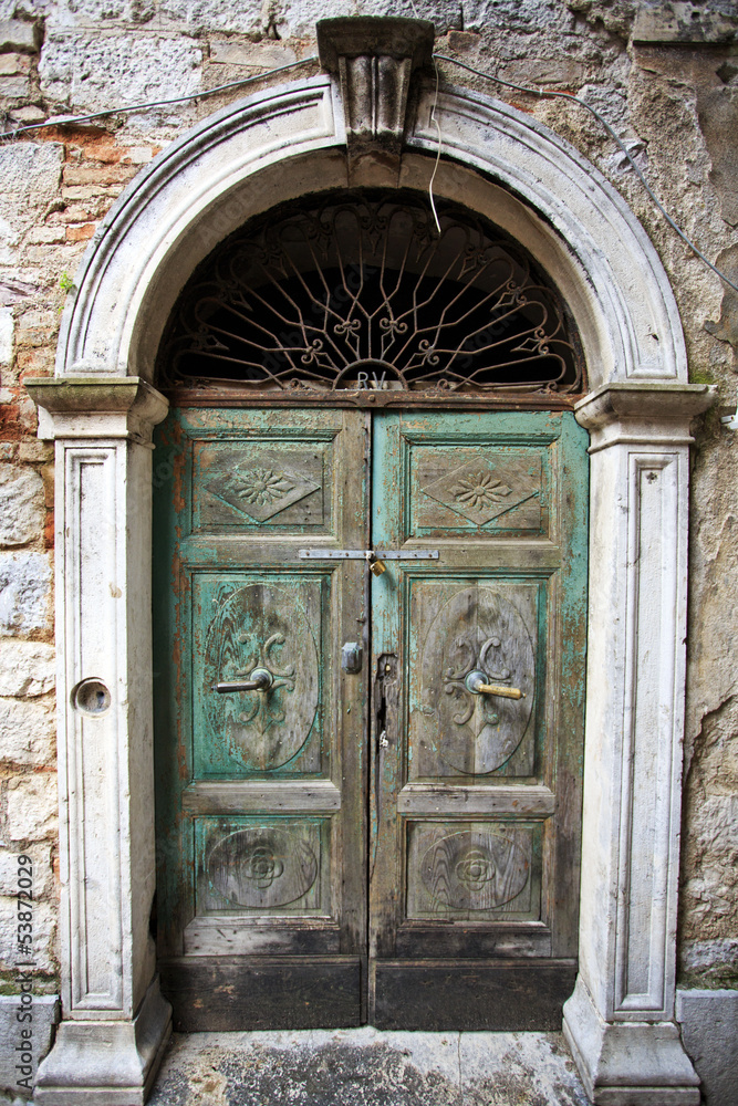 Old green door in Kotor, Montenegro