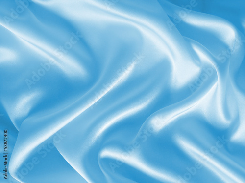 Draped light blue silk background