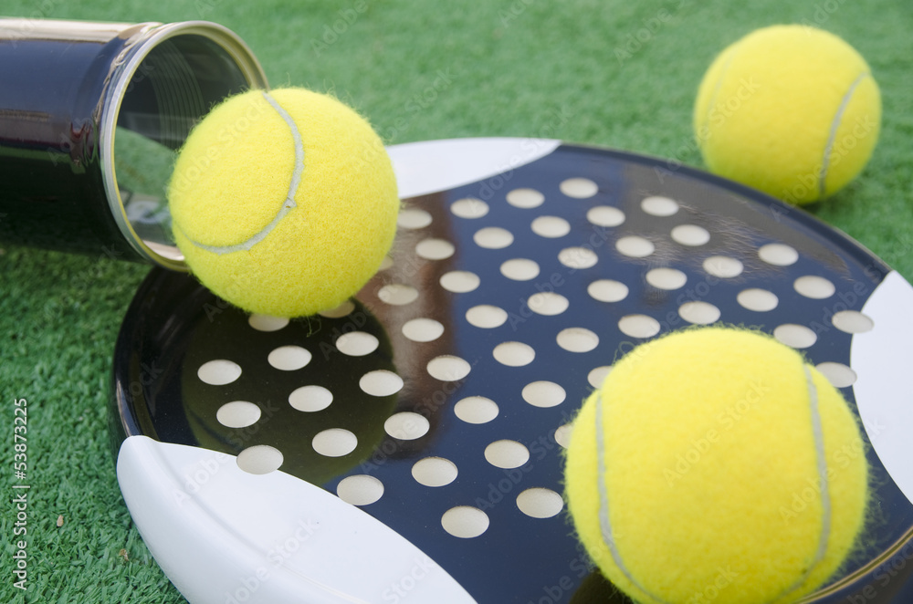 Paddle tennis racket, balls and tube