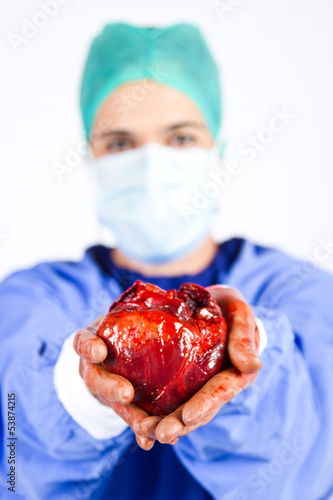 Doctor hold patient heart blur photo