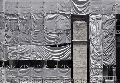 Konstfotografi Building covered with wrinkled tarpaulin canvas