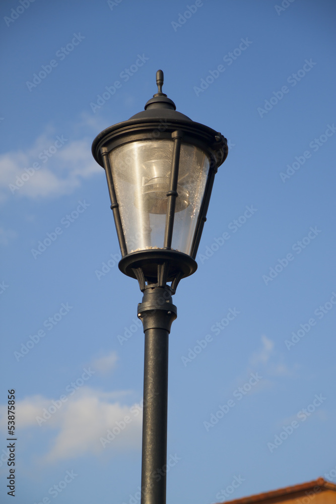 Lamp pole and the blue sky, closeup