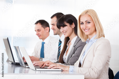 Business People Working On Laptop In Office
