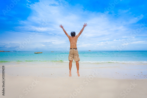 Happy man with beautiful sea and sky for abstract/background use