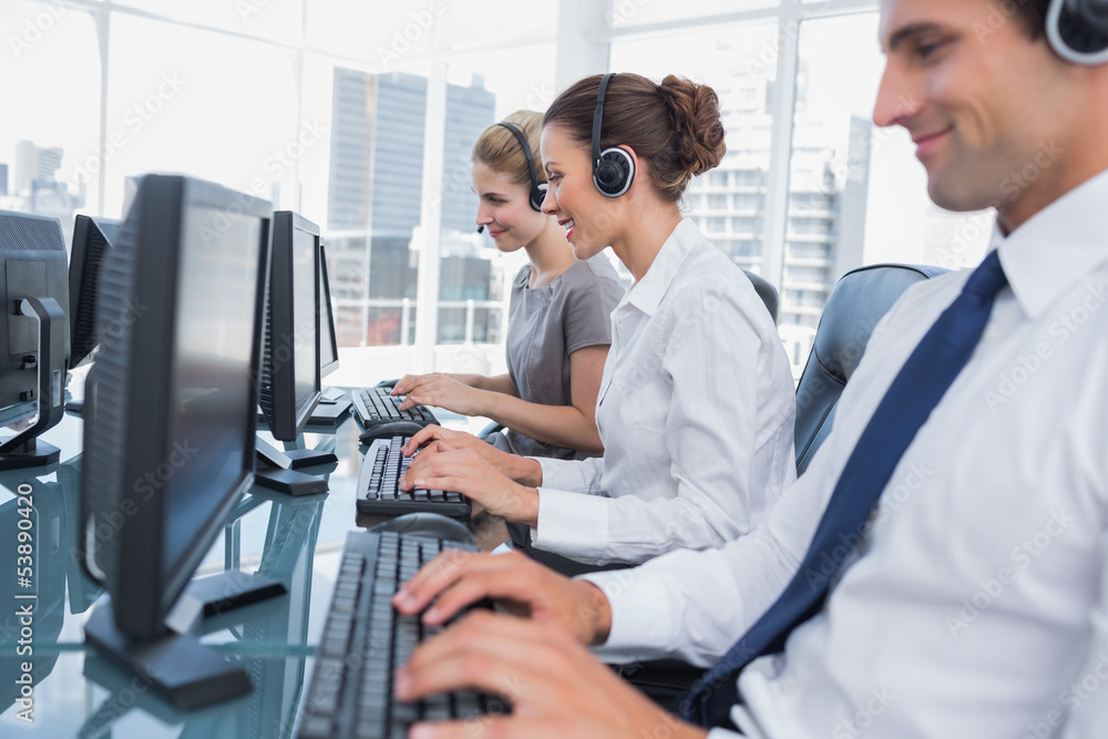 Group of call center agents working in line Group of call center agents working in line
