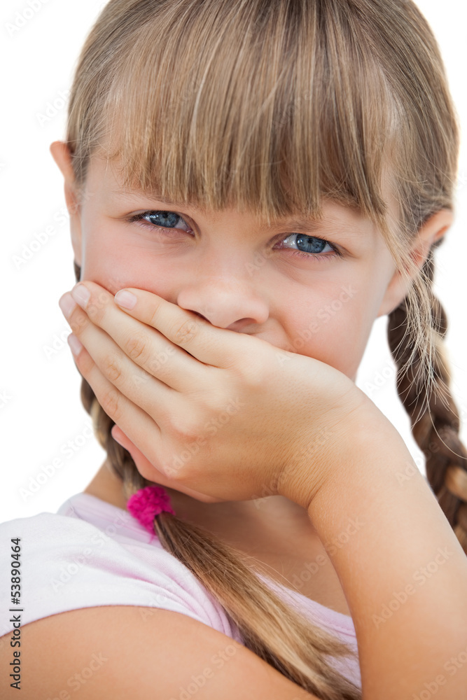 Beautiful little girl with her hand on her mouth Beautiful little girl with her hand on her mouth