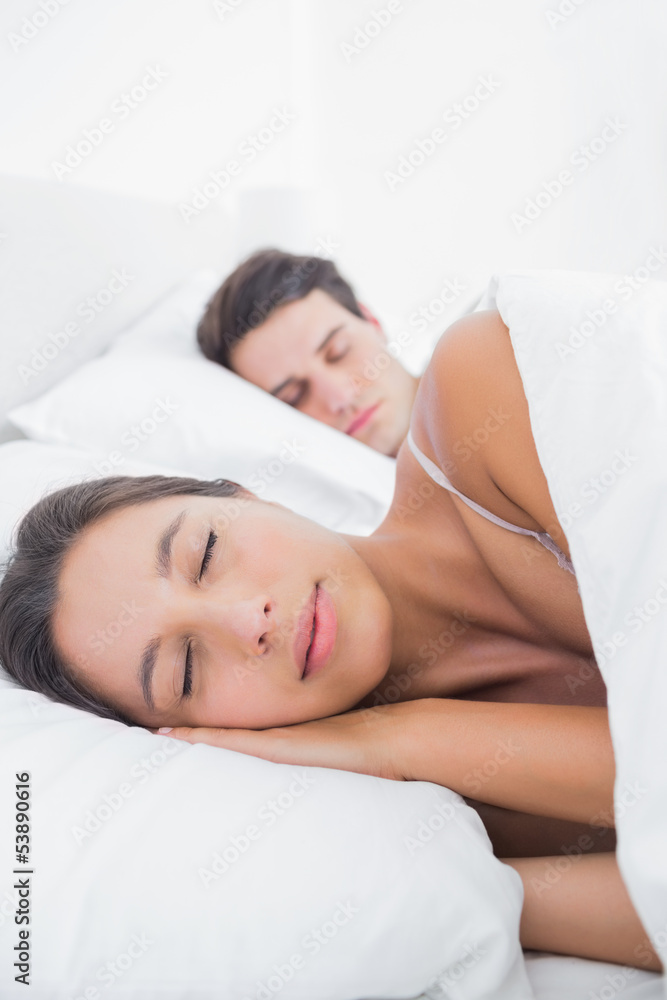 Beautiful woman sleeping next to her partner Beautiful woman sleeping next to her partner