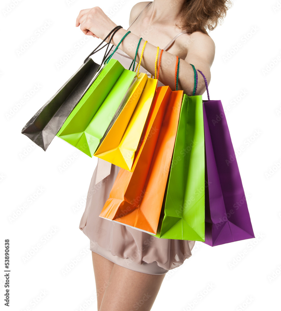 Multicolored paper bags on female hand
