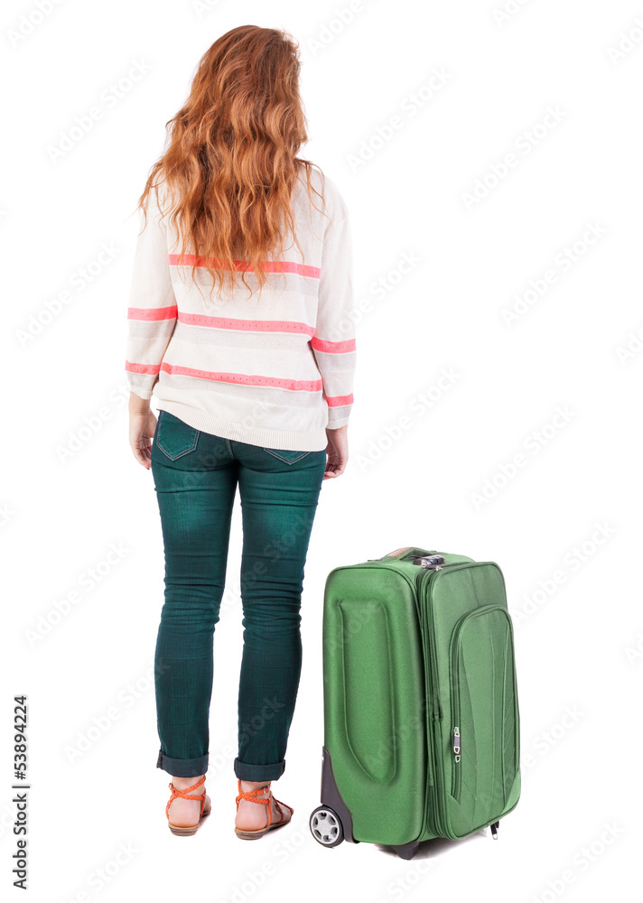 back view of walking woman with suitcase. back view of walking woman with suitcase.