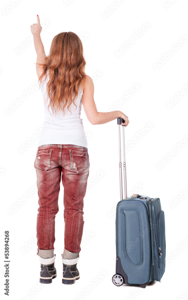 Back view of pointing woman with suitcase looking up Back view of pointing woman with suitcase looking up