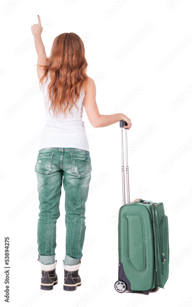 Back view of pointing woman with suitcase looking up Back view of pointing woman with suitcase looking up