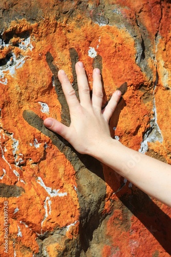 Obraz na plátně hand and painting on rock