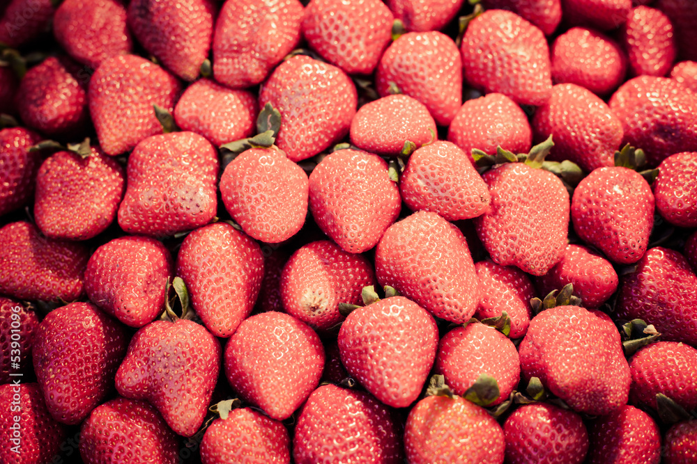 Strawberries displayed at a farmers' market Strawberries displayed at a farmers' market