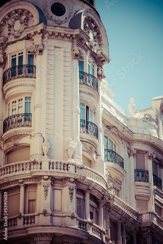 Old ornamental building at Gran Via in Madrid, Spain photo