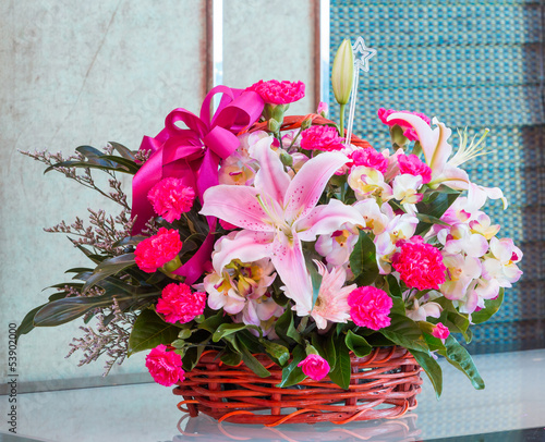 Fototapeta Naklejka Na Ścianę i Meble -  Bouquet of flower in wicker basket