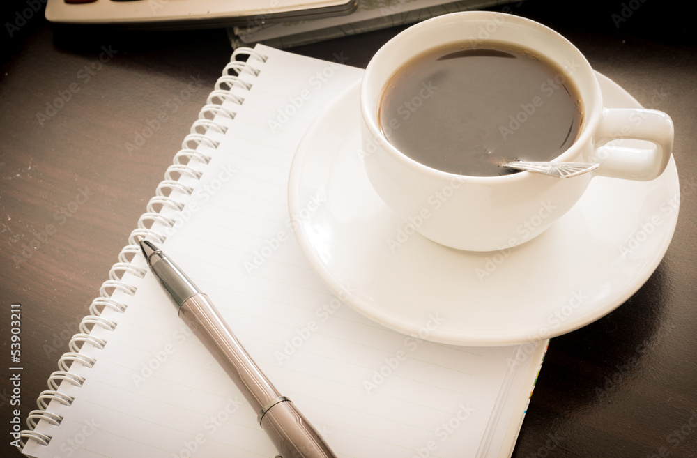 Coffee and the calculator and pen Coffee and the calculator and pen