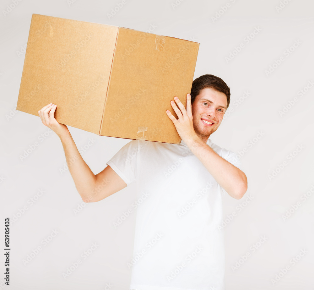 smiling man carrying carton box smiling man carrying carton box