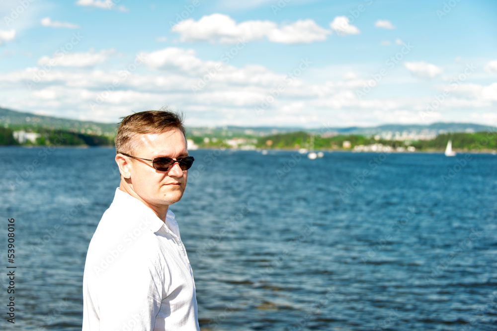 Man portrait with sea on background