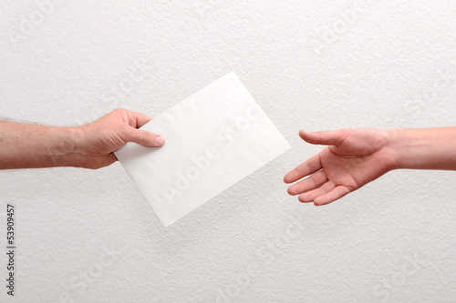 Give someone money in envelop for corruption purposes