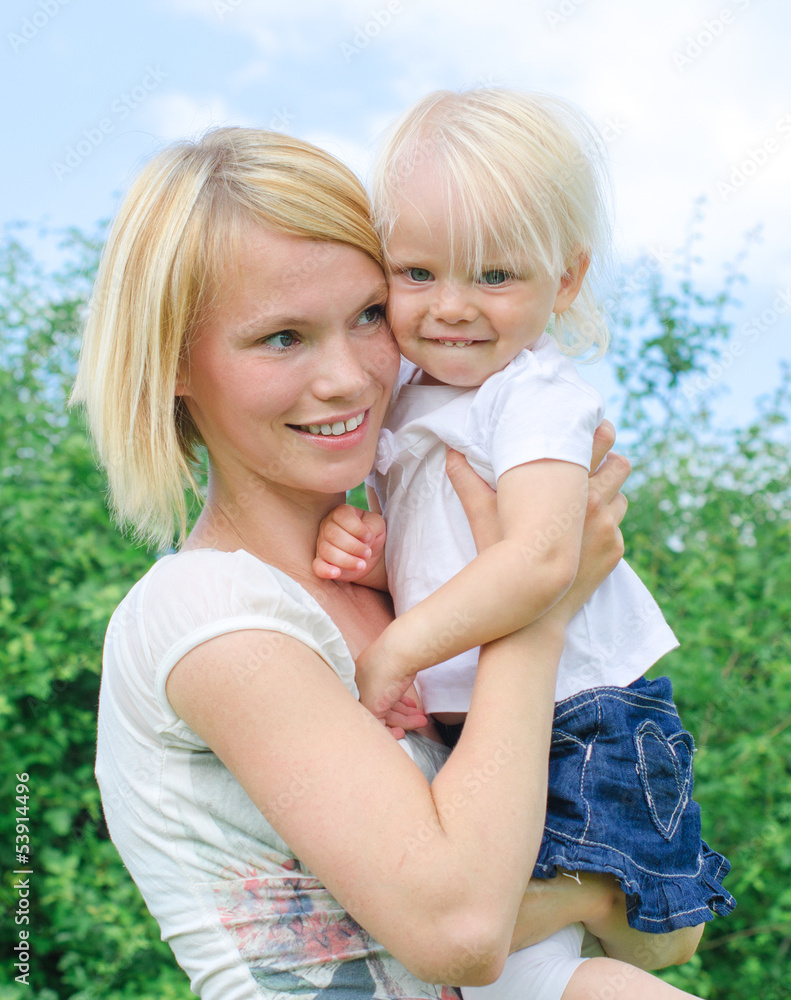 Woman and little girl in the park Woman and little girl in the park