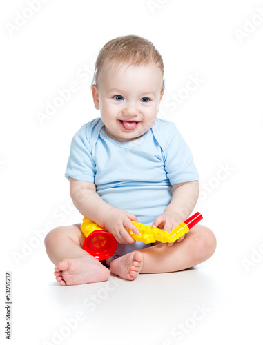 kid playing musical toy iso...