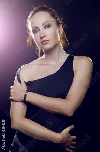 Beautiful girl brutal, with long reddish tail in a black t-shirt