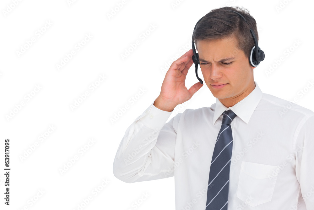 Call centre agent using headset and touching it Call centre agent using headset and touching it