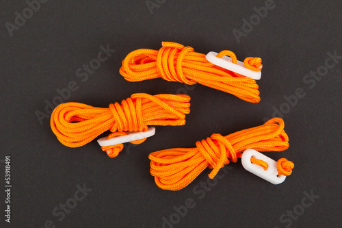 Orange rope used for bracing a tent