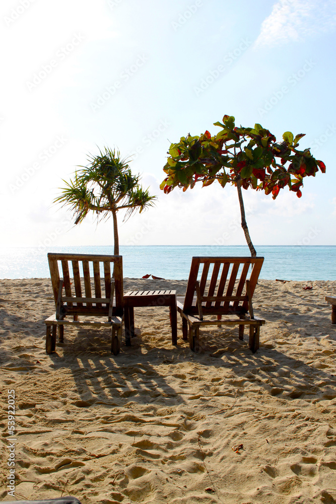 Zanzibar White Sandy Beach And Wooden Chairs
