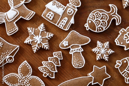 Gingerbread cookies on wooden background.