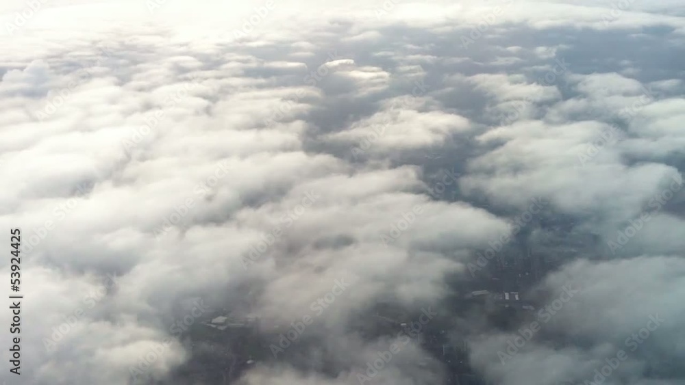 Above Fluffy Whire Clouds