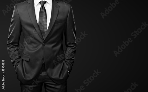 man in suit on black background