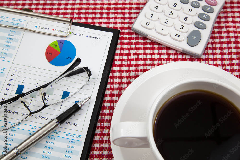Business report and cup of coffee Business report and cup of coffee