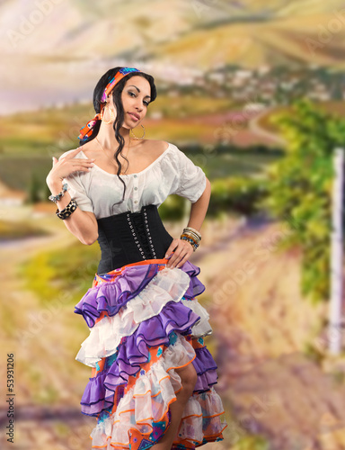 Portrait of Gypsy girl with Andalusian landscape