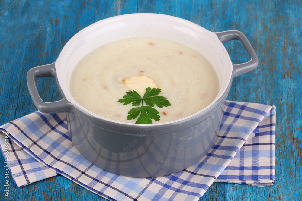 Mashed potatoes in saucepan on blue wooden table Mashed potatoes in saucepan on blue wooden table