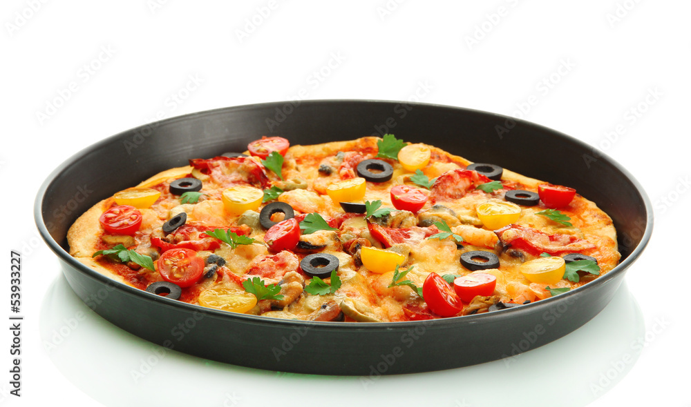 Delicious pizza with seafood in the frying pan isolated on Delicious pizza with seafood in the frying pan isolated on