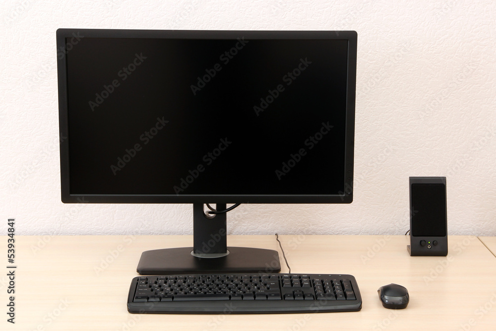 Computer on table in room Computer on table in room