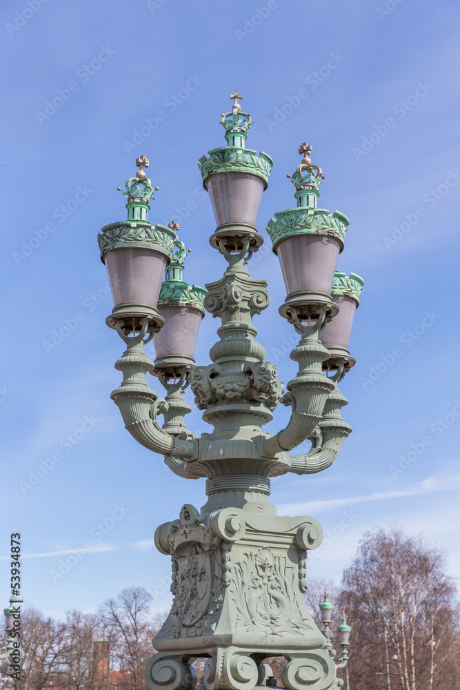 Ornamental street lamps with a blue sky