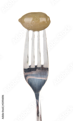 Canned plum sticking on fork, isolated on white