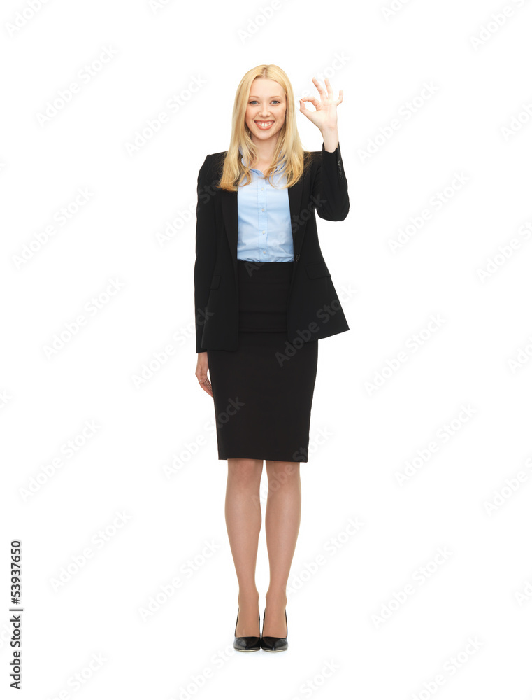young businesswoman showing ok sign young businesswoman showing ok sign