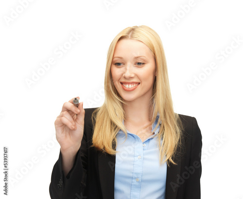 businesswoman writing something in the air