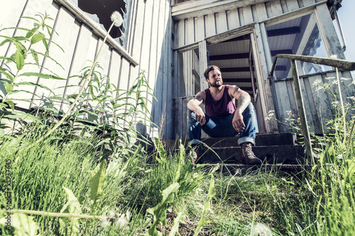 Photos Punk rocker sitting on staircase