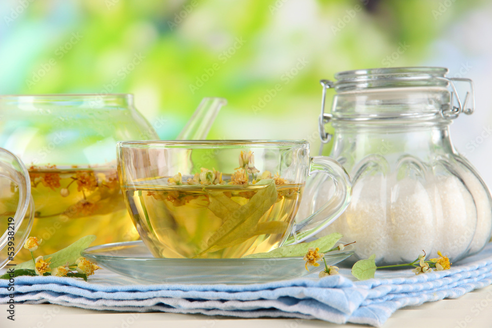 Kettle and cup of tea with linden Kettle and cup of tea with linden