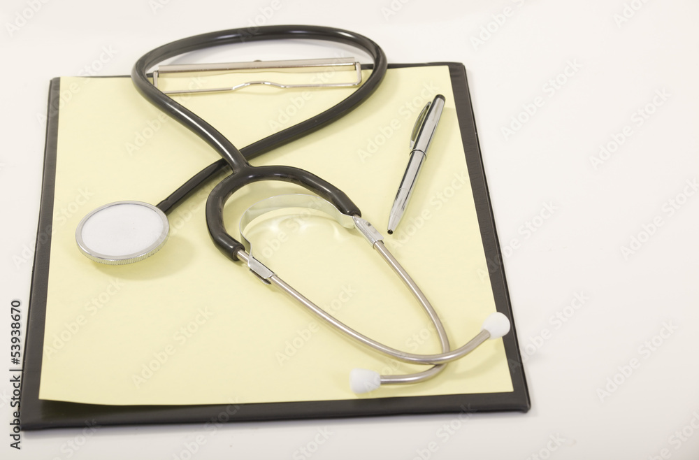 Medical Stethoscope with Pen on Medical File Folders