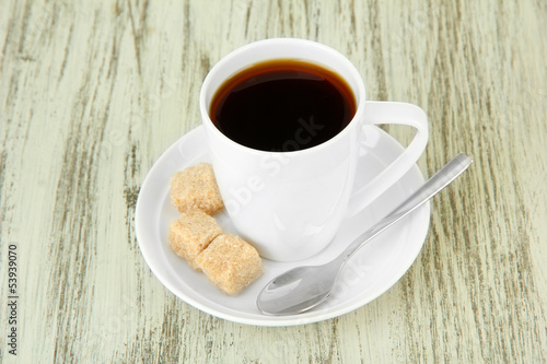 Cup of coffee, on color wooden background