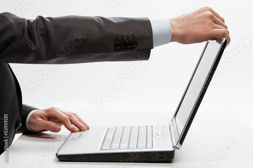 Businessman opening laptop