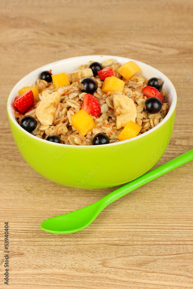 Oatmeal with fruits on table close-up Oatmeal with fruits on table close-up