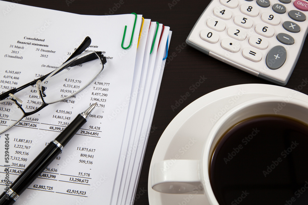 Business report and cup of coffee Business report and cup of coffee
